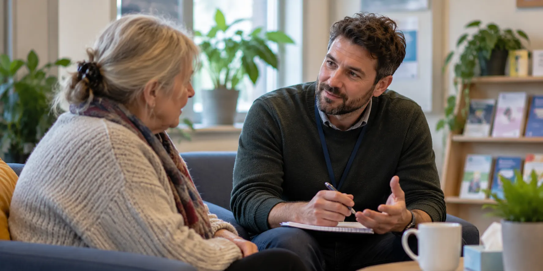 A support adviser talking with someone across a table